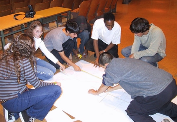 Students working out speaker placement